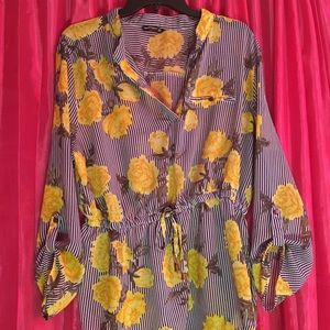 Yellow floral blouse.